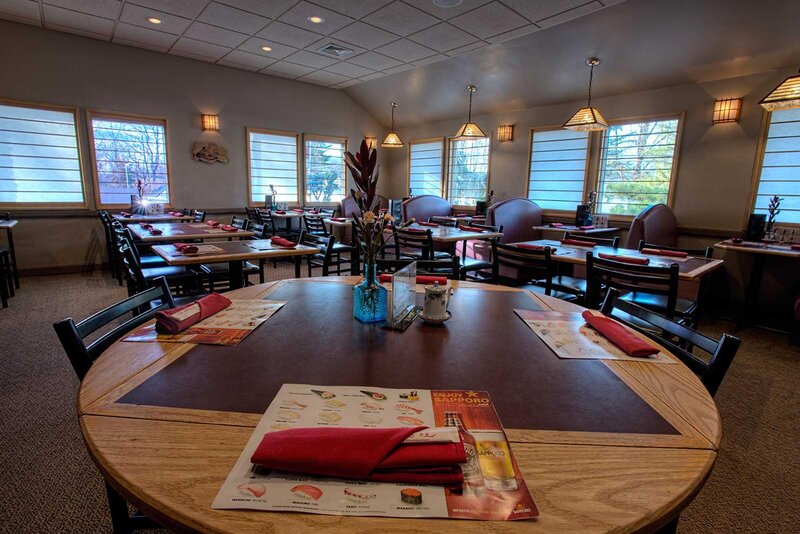 Dining room with focus on round table set for four