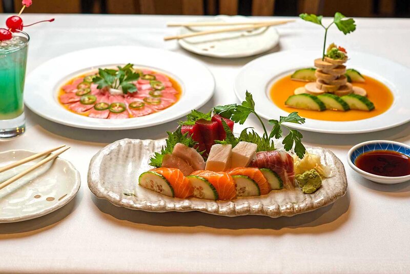 Plated sushi with meat and vegetables