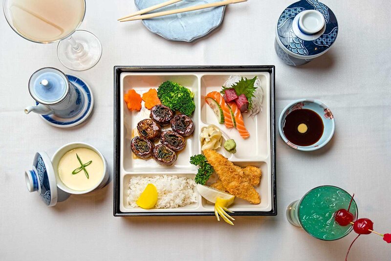 Overhead view of combination box with soup and drinks