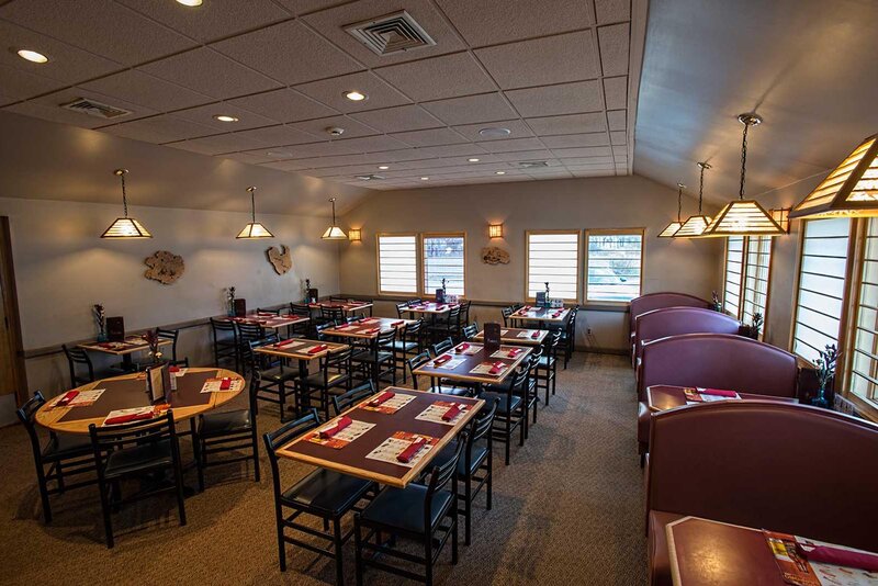 Dining room with set tables and booth seating